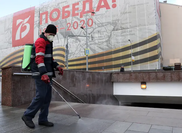 A utility worker disinfecting an underground walkway in central Moscow