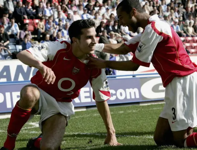 Robin van Persie celebrates with Ashley Cole