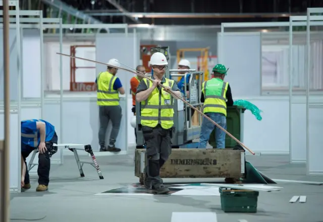 Construction workers at NHS Louisa Jordan hospital