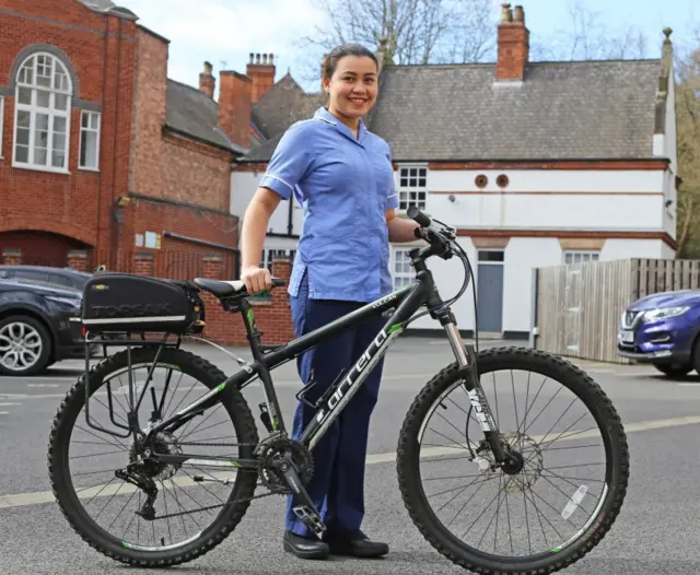 QMC nurse with new bike