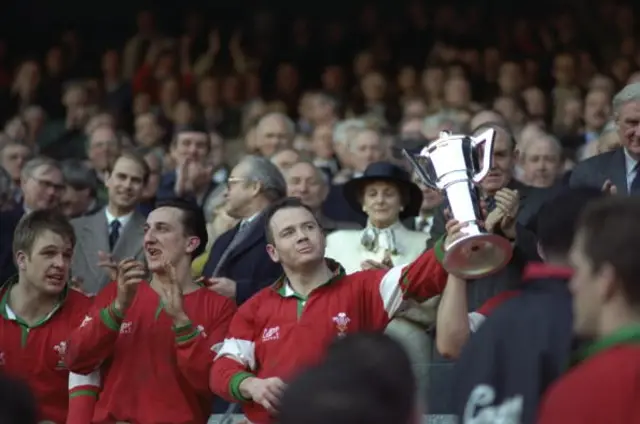 Wales captain Ieuan Evans lifts the 1994 Five Nations trophy after losing to England