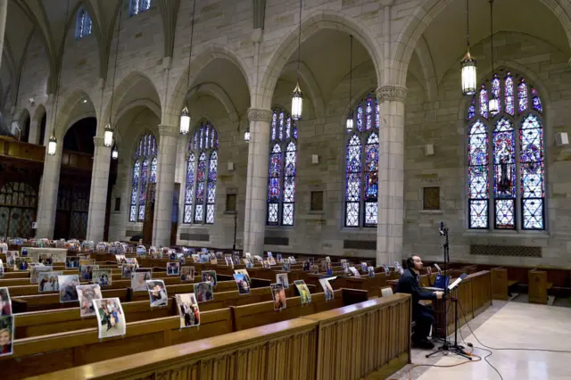 Mass at Our Lady of Sorrows Catholic Church in South Orange, New Jersey is streamed live, which parishioners' photos being placed on the seats.