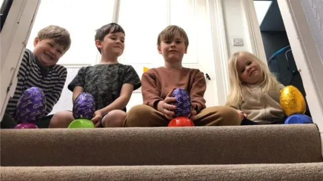 Reggie, 9, Smith, 8, Flynn, 5, and Bay, 3, just before they rolled their eggs down the stairs inside their house in Edinburgh