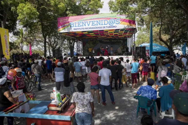 People attend an event at the touristic centre of Puerto del Gran Lago, in Granada, Nicaragua, 11 April 2020