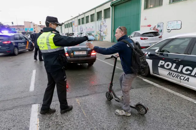 Spanish police are handing out masks as some people return to work