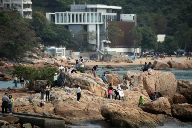 Beachgoers on Hong Kong's Stanley Beach on 10 April 2020