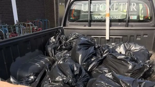 Bin bags on back of vehicle