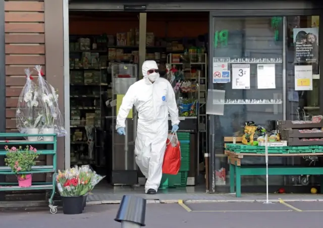 A man wears protective clothing in Nice