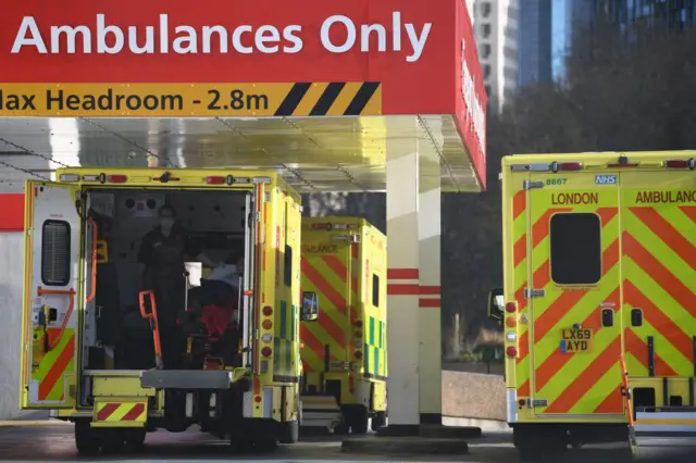 Ambulances park outside the entrance to the emergency departmen