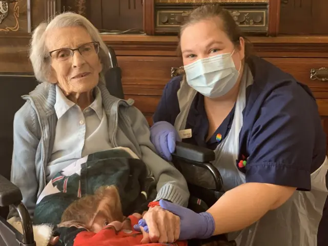 Connie Titchen pictured with a member of staff