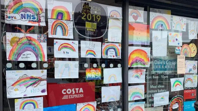 Rainbow pictures in Coop window