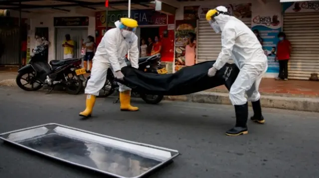 Medics carrying a bodybag