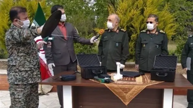 An Iranian TV reporter interviews Revolutionary Guards commander Maj-Gen Hossein Salami (2nd left)