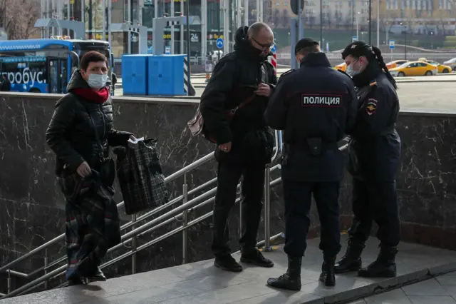 Russian police check a man's digital pass