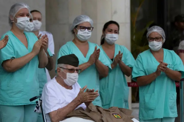 World War II veteran Ermando Armelino Piveta, 99, is discharged after overcoming COVID-19 at the Armed Forces Hospital (HFA), in Brasilia, Brazil, 14 April 2020.