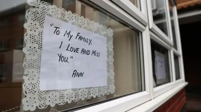 Message to family in window of care home