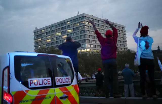 People clap on Westminster Bridge