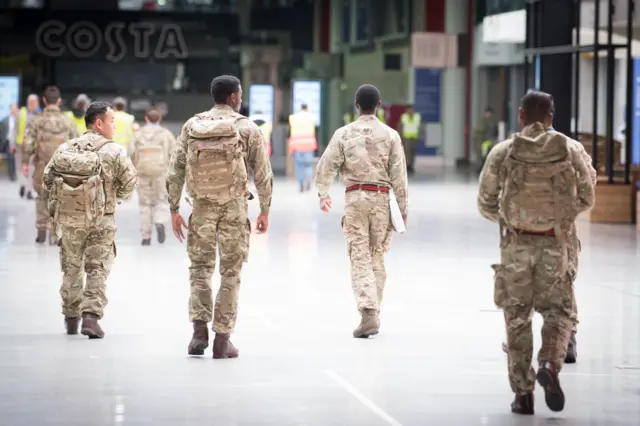 Soldiers pictured at the site of the temporary NHS Nightingale hospital in London