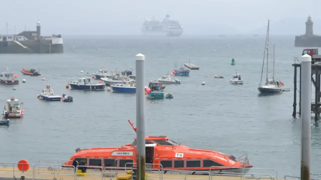 Cruise ship and tender boad