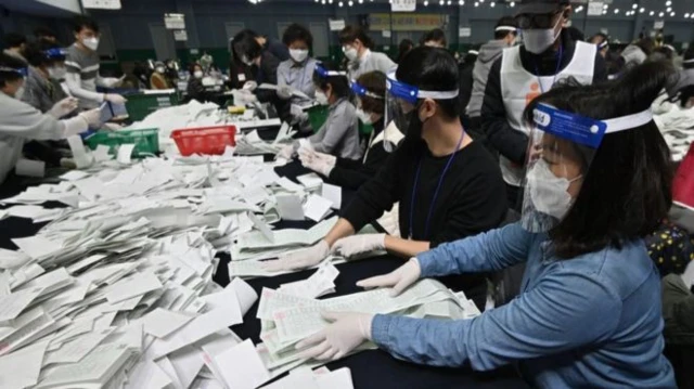 Election workers wearing face masks