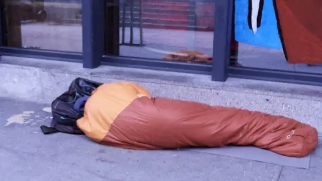 Homeless person in a sleeping bag