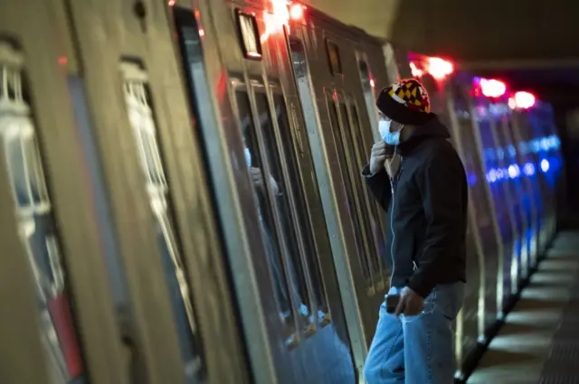 A man boards a train in Washington DC