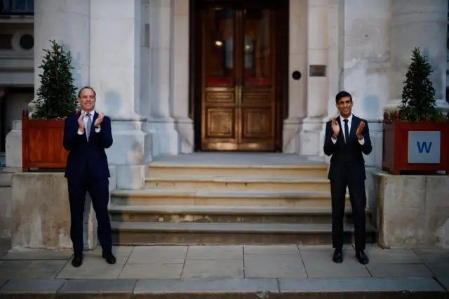 Dominic Raab and Rishi Sunak take part in the clap for carers