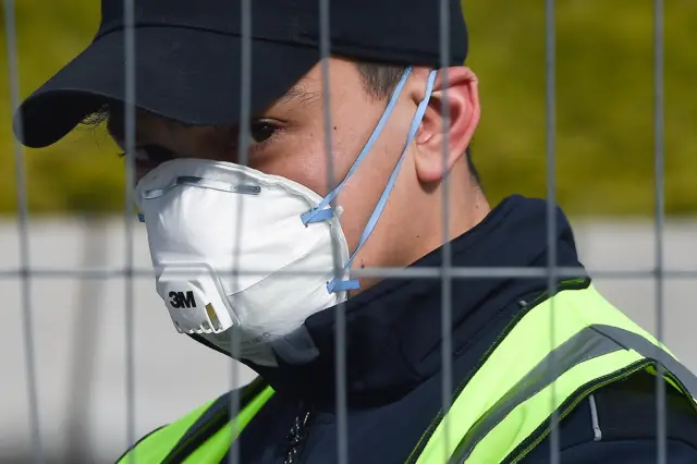 A construction worker at the SEC in Glasgow wears a face mask