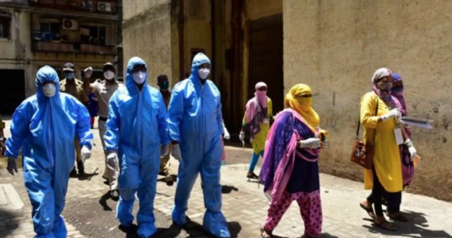 Health workers and Asha workers patrolling a neighbourhood in India