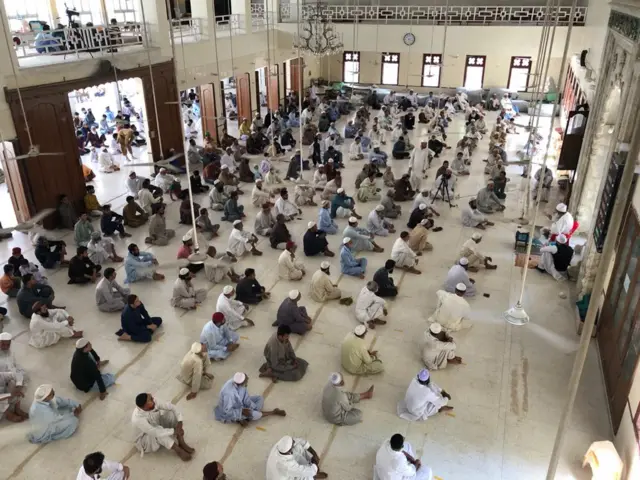 Devotees praying inside Jamia Thanvi Mosque in Karachi