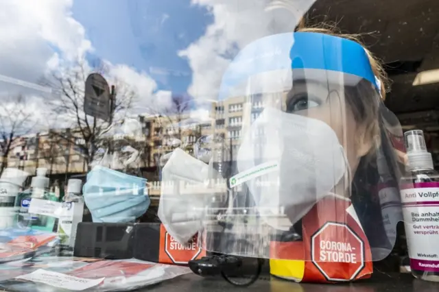 Protective face masks are on display at a shop in Berlin