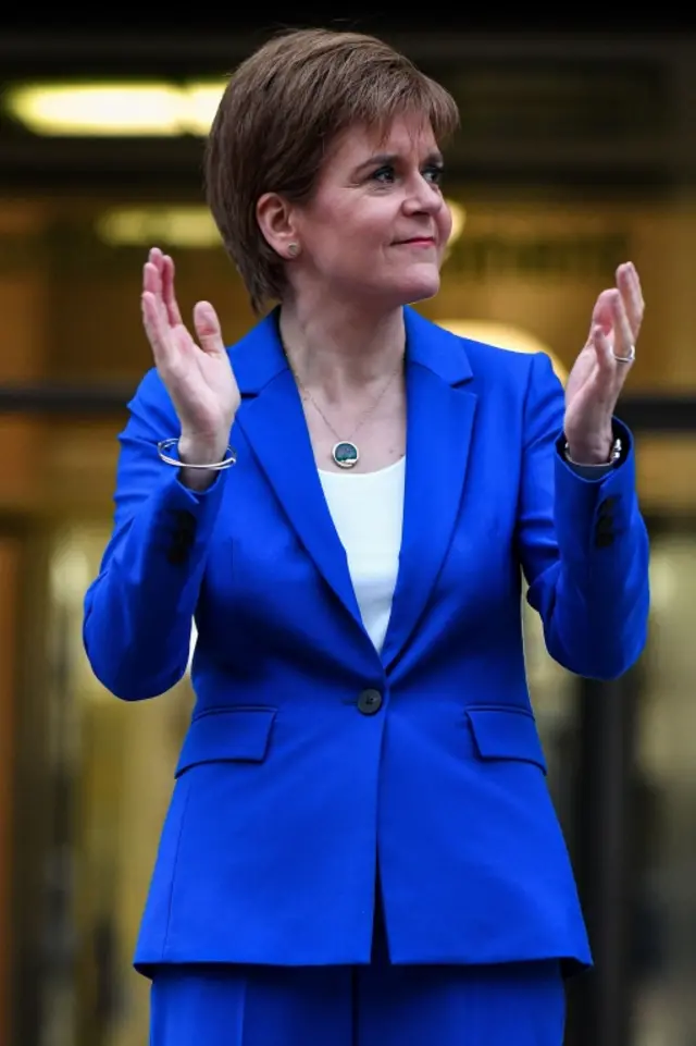 Nicola Sturgeon claps carers