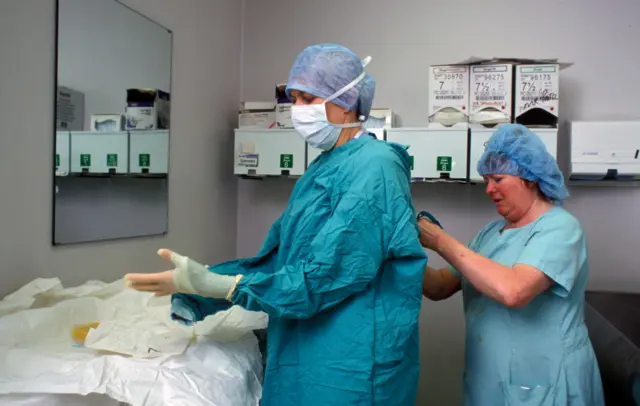 Hospital workers in gowns