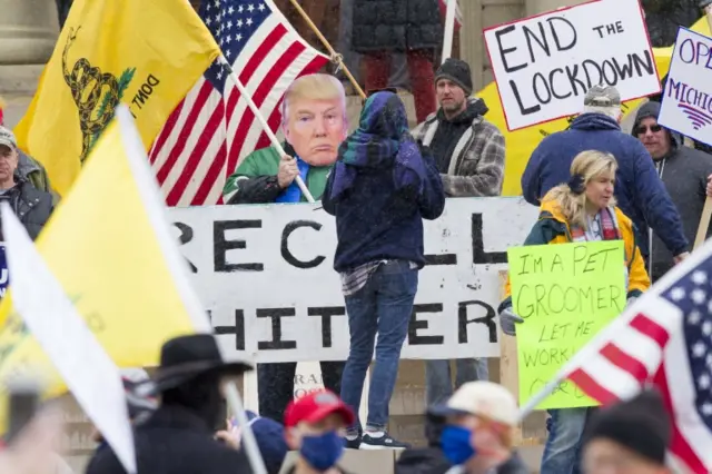 Protesters join in "Operation Gridlock" near the Michigan state Capitol in Lansing, Michigan