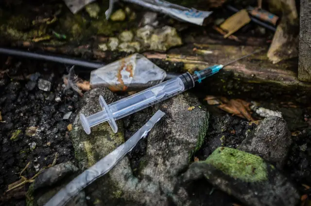 Discarded drugs paraphenallia in a small wooded area used by addicts  near Glasgow city centre