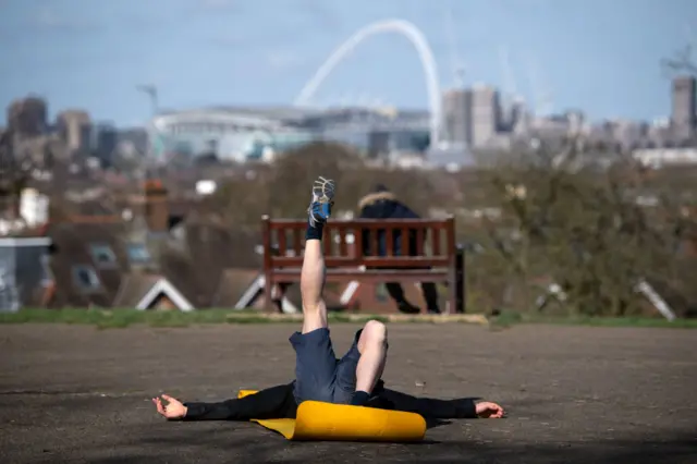 A man exercising alone in London