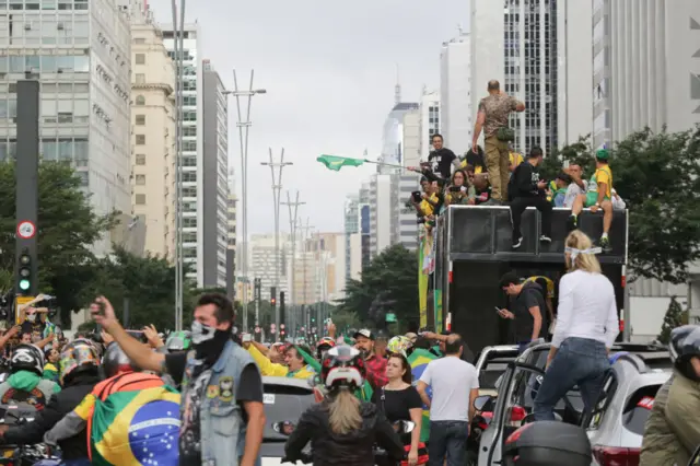 Protesters drive through the streets of Sao Paulo