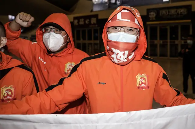 Fans of the Wuhan Zall football team welcome team members home