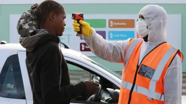 Informal traders temperature is checked at the gate of Cape Town Market