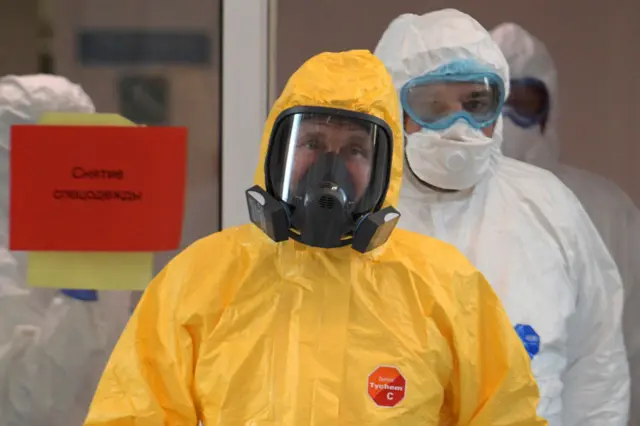 Vadimir Putin in a hazmat suit