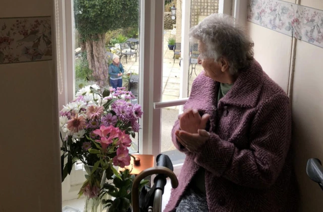 Care home resident claps as opera singer sings outside her window