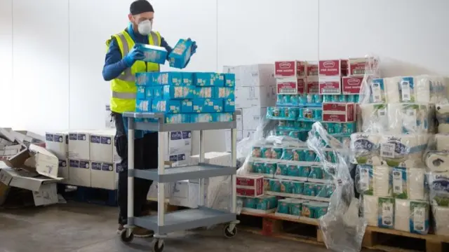 Birmingham City Council staff prepare the first food parcels to be distributed