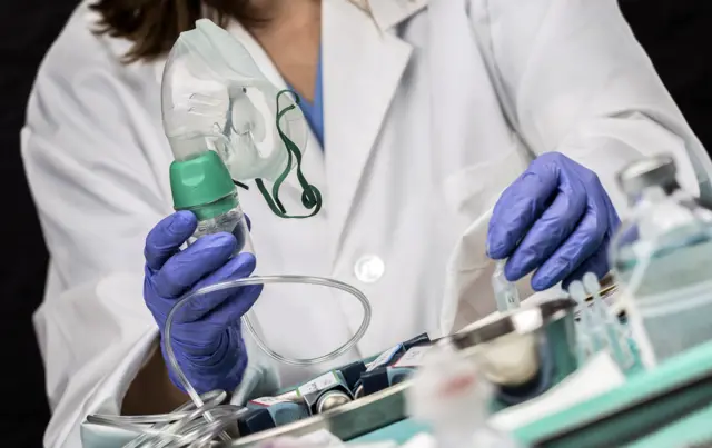 Person holding ventilator equipment