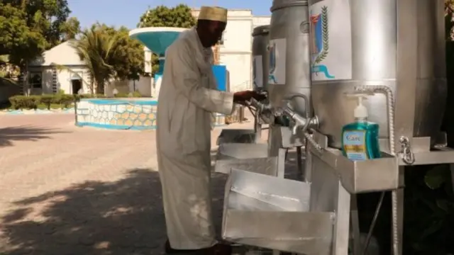 Somalia's most senior cleric Sheikh Ali Dheere at a hand-washing station