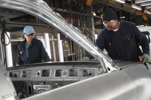 Workers assemble Ford vehicles at the Chicago Assembly Plant