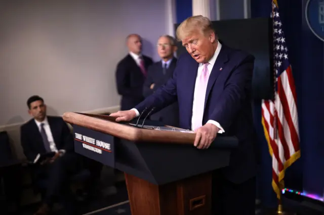 President Donald Trump speaks from the press briefing room with members of the White House coronavirus Task Force (1 April).