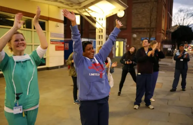 NHS workers applaud on the streets outside Chelsea and Westminster Hospital during the Clap f