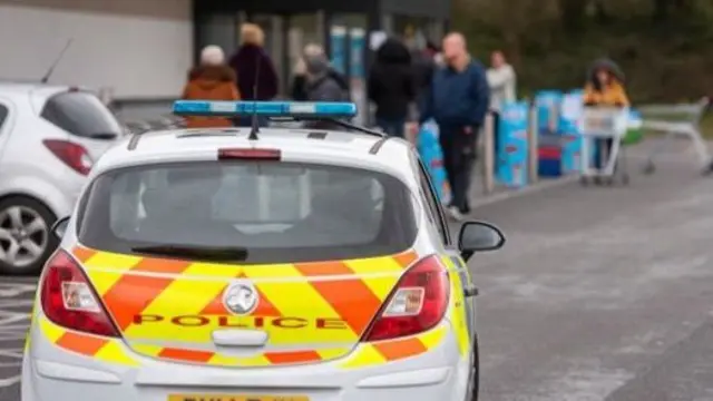 Police car at supermarket