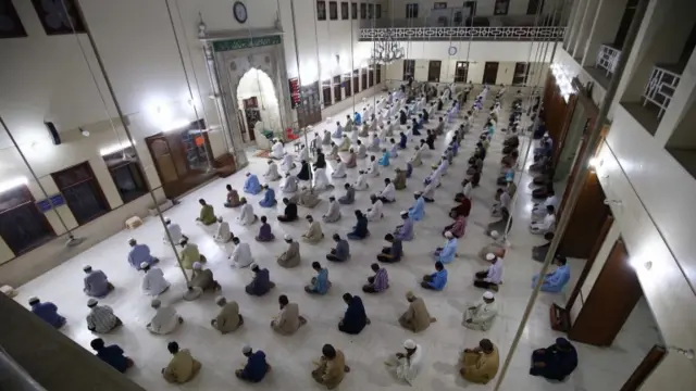 Men praying in a mosque