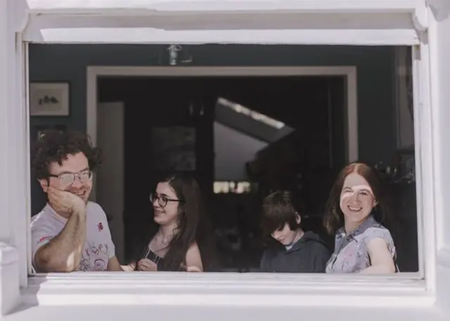 Family in window